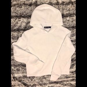 cropped white sweatshirt. size XL but fits like a medium or small. never worn.